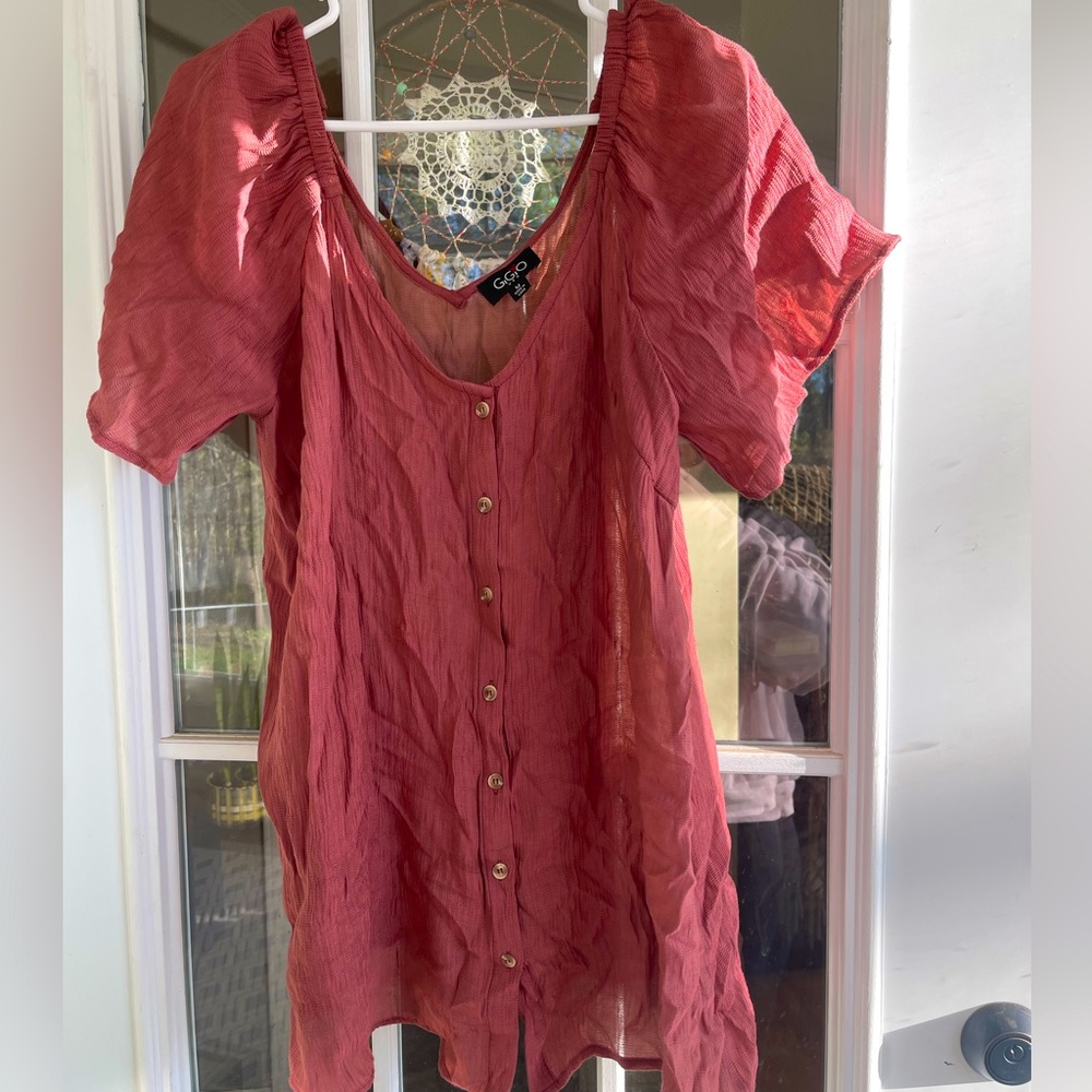 Boutique blouse. Very loose & flowy.